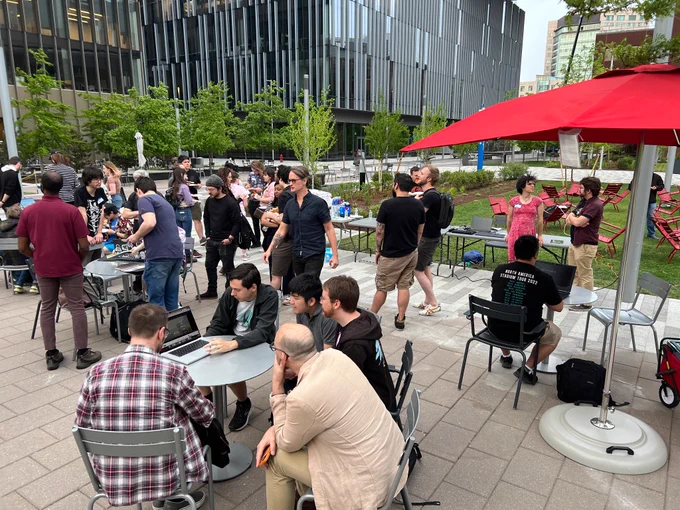 People playing video games outdoors at the Kendall Open Space