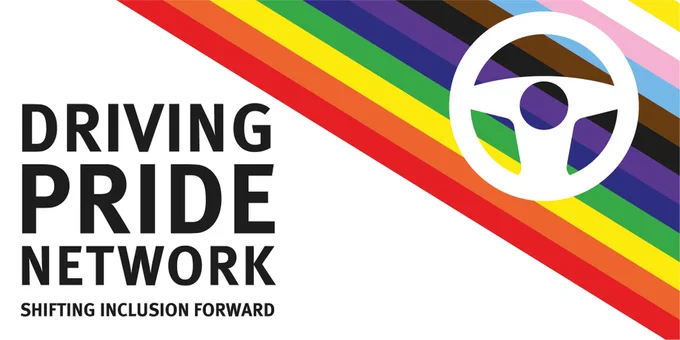 The image shows the Driving Pride logo. The words "Driving Pride Network. Shifting Inclusion Forward" feature on the left-hand side. Diagonally across the top right corner are rainbow stripes in the progress pride colours, with a steering wheel over them.
