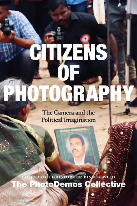 Book cover showing a cropped photograph depicting Sri Lankan women protesters seen from the back, holding up a portrait of a victim of state violence. Two men with cameras are seen holding cameras and taking their picture. The text reads Citizens of Photography The Camera and the Political Imagination, edited by Christopher Pinney with The PhotoDemos Collective. 