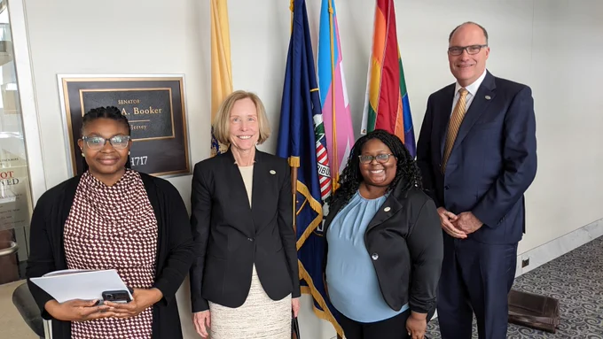 Nadia Laniyan, Ann Stock, Raechel McKinley and Kevin Gardner pose for a photo in front of U.S. Sen. Cory Booker's office. 