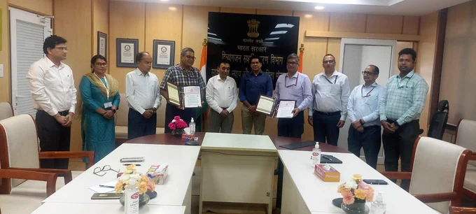 A group photo of MoU signing ceremony held inside the conference room at Department of Empowerment of Persons with Disabilities (DEPWD) office wherein Shri Rajesh Aggarwal, Secretary, DEPwD , Government of India along with Joint Secretary, DPEwD standing at the center alongside with CMD, ALIMCO and DG, CIPET showing  MoU Document. Also seen in the picture are the senior officers from ALIMCO and CIPET.