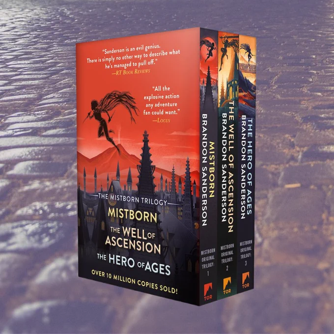 Mistborn Boxed set, featuring a dark figure with a knife jumping from a tree to another tree