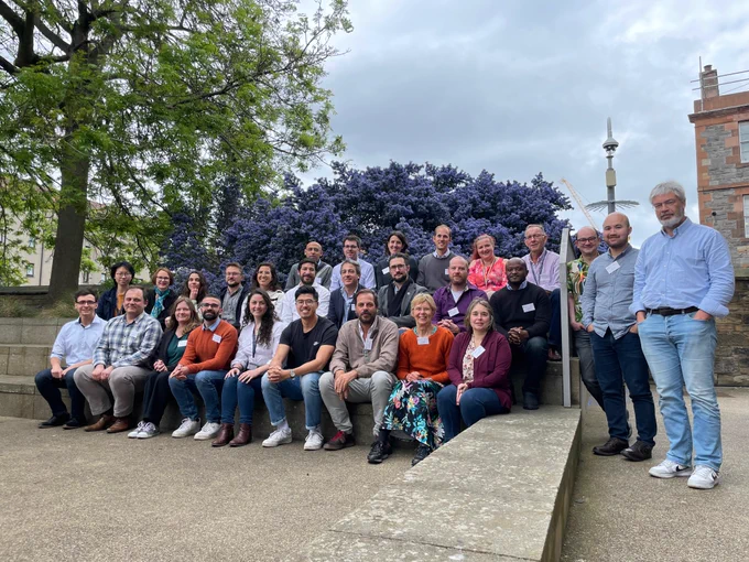 A group photo of researchers attending a conference at Edinburgh University