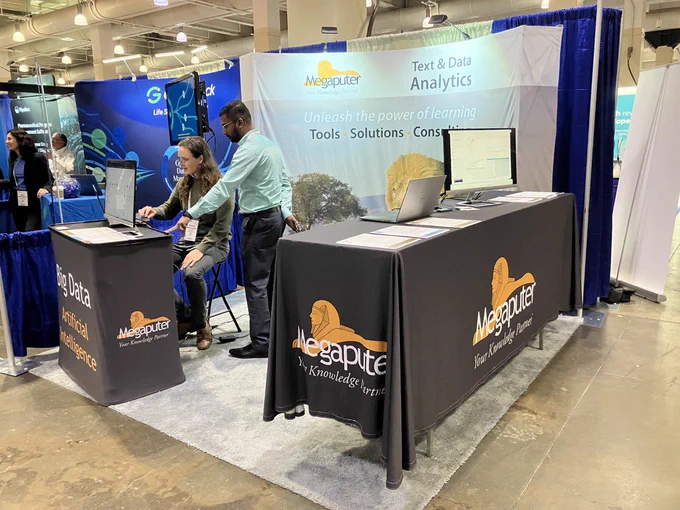 Megaputer team showcasing Insight-D™ NLP solution to engaged conference attendees at Bio-IT 2023. The team members are enthusiastically presenting the innovative solution, demonstrating its features and benefits. The attendees can be seen attentively listening, asking questions, and interacting with the demo. The booth is decorated with vibrant banners and displays, creating a vibrant and dynamic atmosphere.