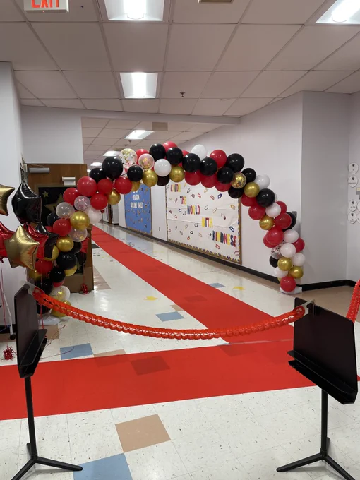 A balloon arch for students and parents to walk through followed by a red carpet for all!