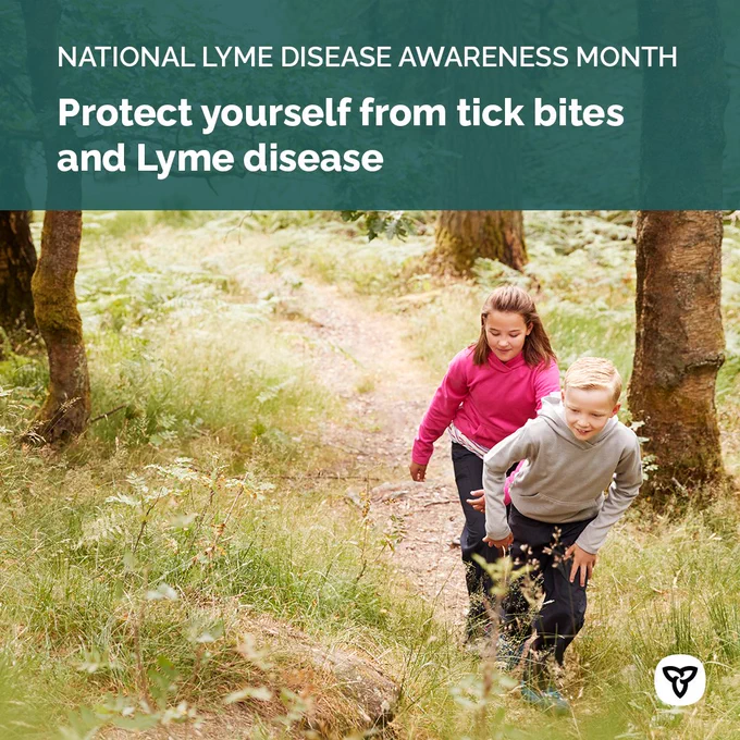 Two kids walking in a park. Image Text: National Lyme Disease Awareness Month. Protect yourself from tick bites and Lyme disease.