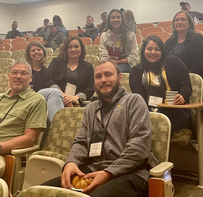 Group of SCC Faculty sitting in lecture hall.