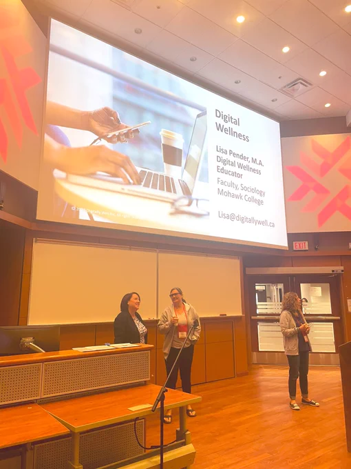 Projector screen with title slide of Digital Wellness presentation.