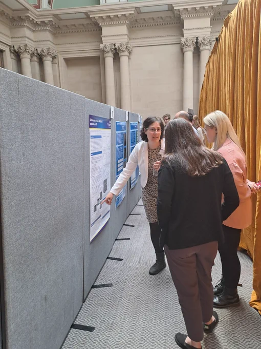Rosa Sanchez Panchuelo talks through her poster to delegates