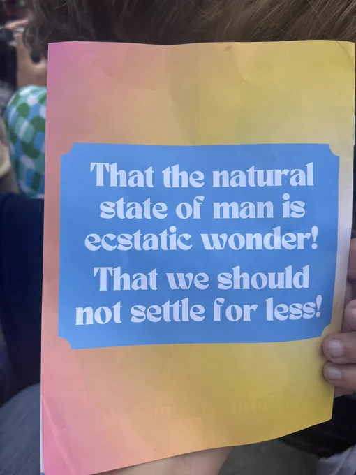 Back of program with quote “that the natural state of man is ecstatic wonder! That we should not settle for less!”
