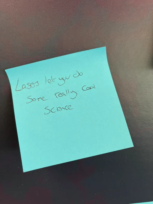 Sticky note saying: “Lasers let you do some really cool science”