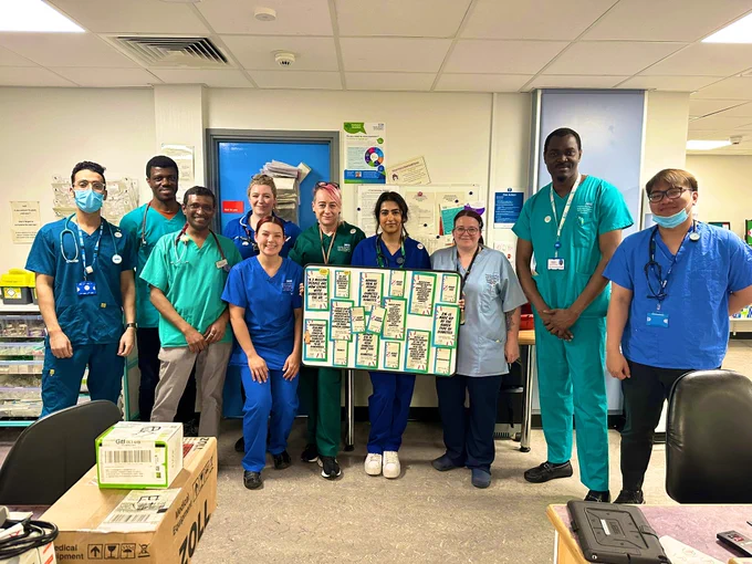 Group of health care professionals holding a board containing helpful hints on Insulin safety and facts around diabetes to raise awareness for insulin safety week