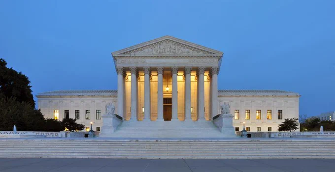 Night falling on the Supreme Court (Photo by Joe Ravi via Wikimedia Commons). 