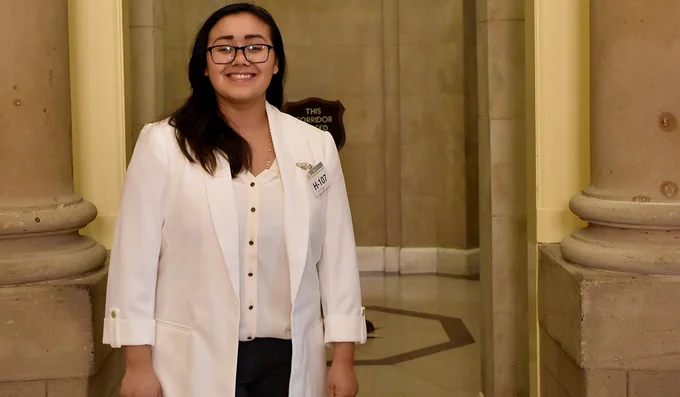 Lluvia Castillo stands in front of House Speaker Kevin McCarthy’s office entrance inside the U.S. Capitol building