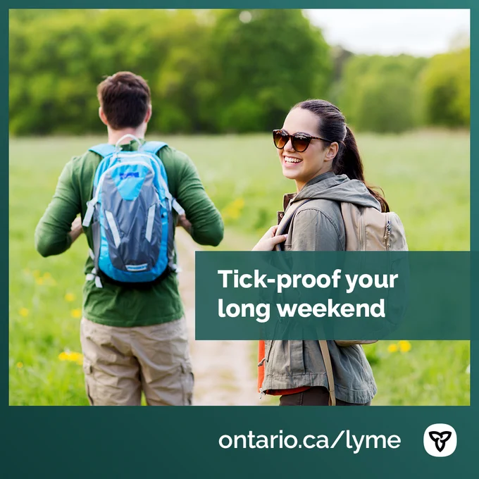 Two people walking along a trail. Image Text: Tick-proof your long weekend. ontario.ca/lyme