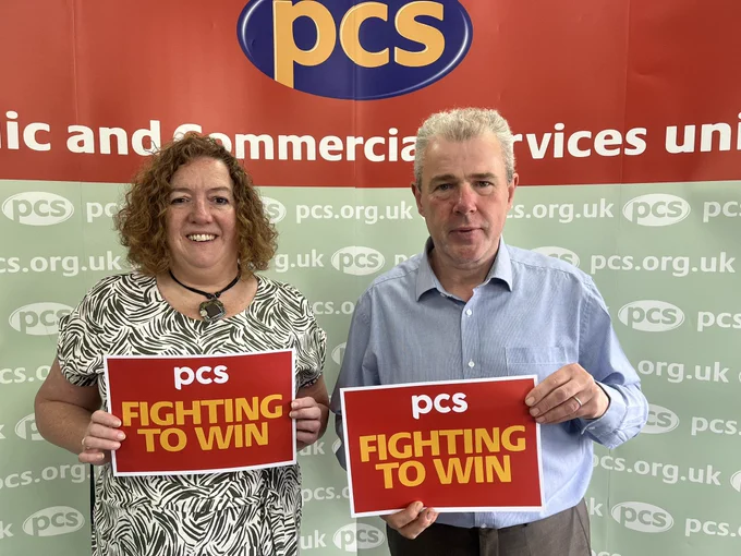 Fran Heathcote and Mark Serwotka holding signs saying fighting to win’