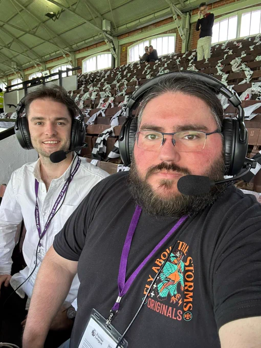 Sam and Alex mic'd up in their commentary position pre-match 