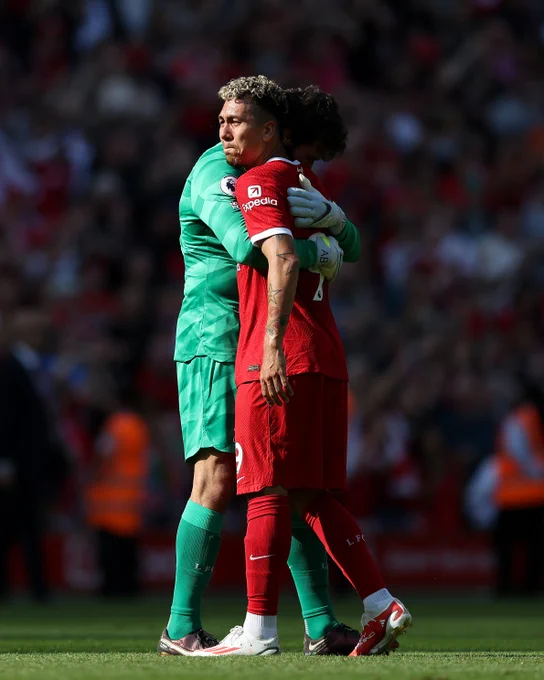 Alisson Becker hugs Roberto Firmino at full-time following his last Anfield appearance for the Reds. 