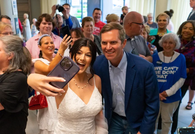 A bride stopped by on her big day to say hi to Andy