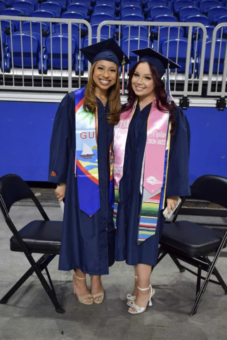 Graduates pose for a photo.