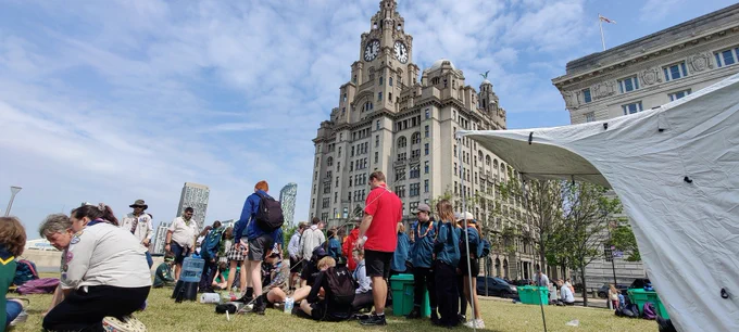 Cubs, scouts and explorers enjoying activities in front of the Liver Building in Liverpool.