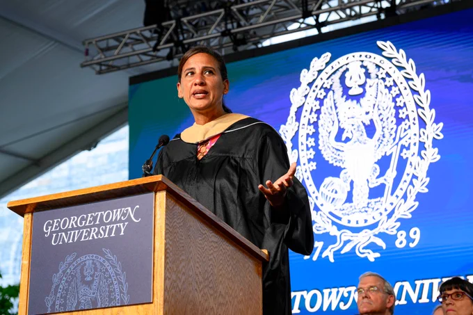 Nicole Bibbins Sedaca speaking at the podium 