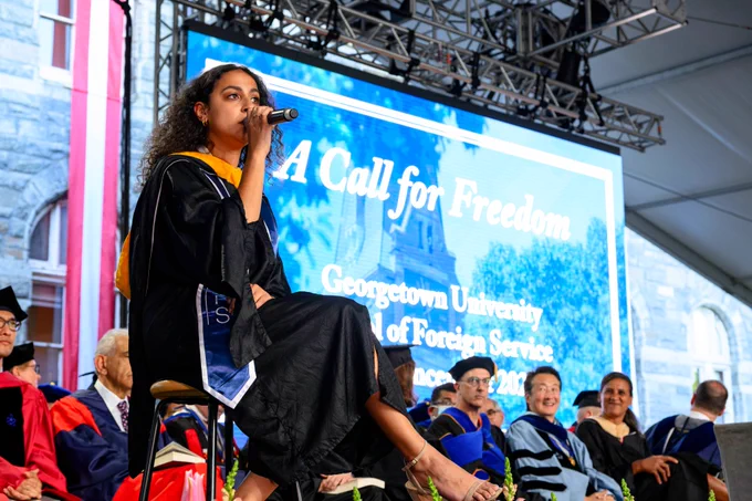 Sylvia Yacoub (MSFS’23) on stage singing 