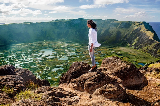 Monique Péan standing at the edge of a crater