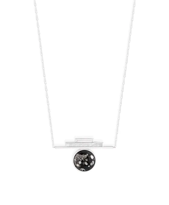 Silver chain with a silver pendant of two stacked rectangles above an obsidian circle with white specks