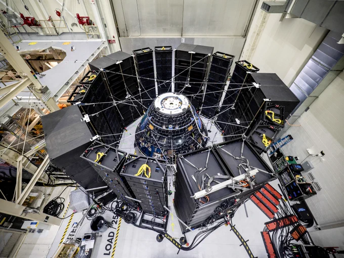 Orion crew capsule surrounded by speakers for its direct-field acoustic testing in 2019.