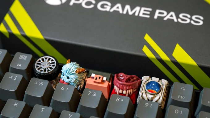 The custom Clackeys key caps arranged on the top row of a keyboard, including a tyre for Forza Motorsport, a yeti for League of Legends, a piglin for Minecraft Legends, vampire fangs for Redfall, and a Constellation spacecraft for Starfield.