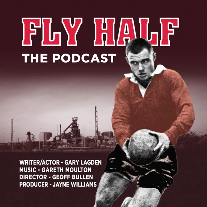 The words 'FLY HALF The Podcast' appear in red lettering, the font type used for names on the back of a Rugby jersey. Set on the backdrop of a South Wales Steelworks. A Rugy player wearing red and black leans to the right, ball in hand. 