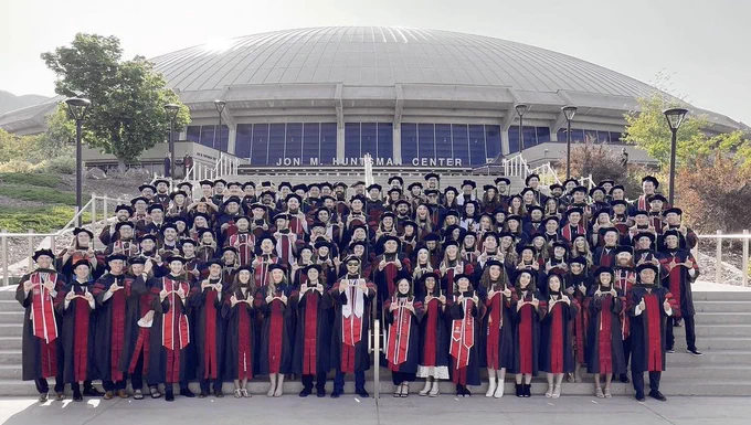 Class photo on the stairs in front of the Huntsman Center.