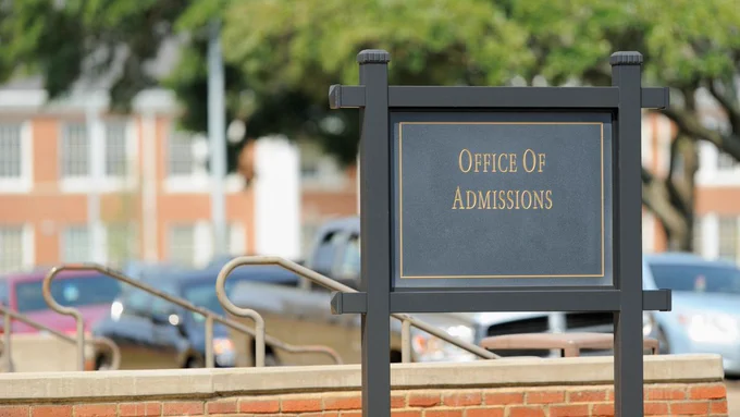A sign for a college office of admissions. 