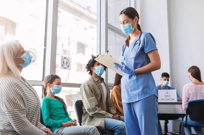 Patients waiting in hospital for COVID vaccine