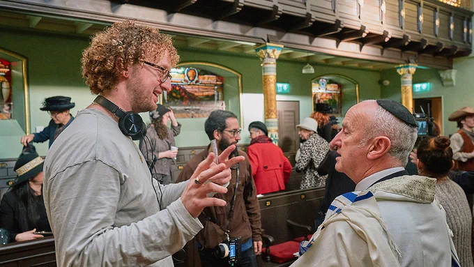 Jakob Lancaster directs a cast member on a location shoot for THE LAST COWBOY IN SALFORD