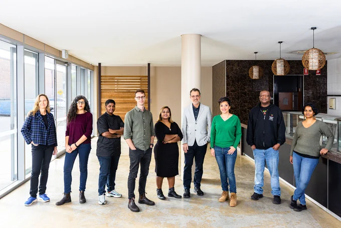 FoodLab staff and entrepreneurs standing in FoodLab's new commercial kitchen