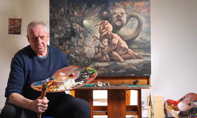 Artist Peter Howson in front of one of his paintings