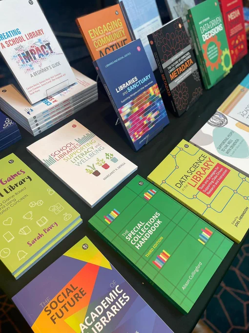 A close up photo of Facet books laid out on a conference table