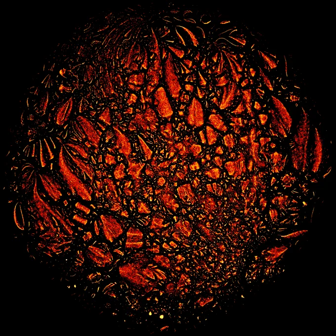 Scatterplot of many points using a fire-theme palette on a black background. The points cluster in small groups. The general shape is circular, as is common of TSNE embeddings.