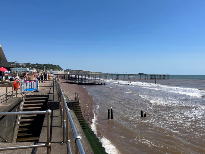 Image of Teignmouth Seafront facing the pier in the distance. Taken in June in the sunshine. 