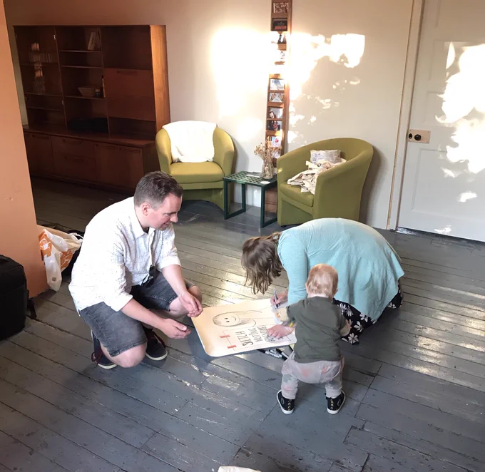 Johann, Marianne and Ada creating a poster