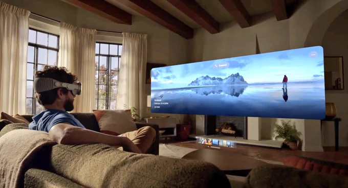 person watching giant cinema screen using Apple Vision pro headset at home on sofa