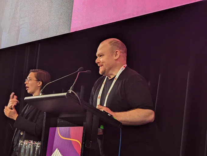 Michael Perry from Treasury Wine Estate presenting at a lectern 