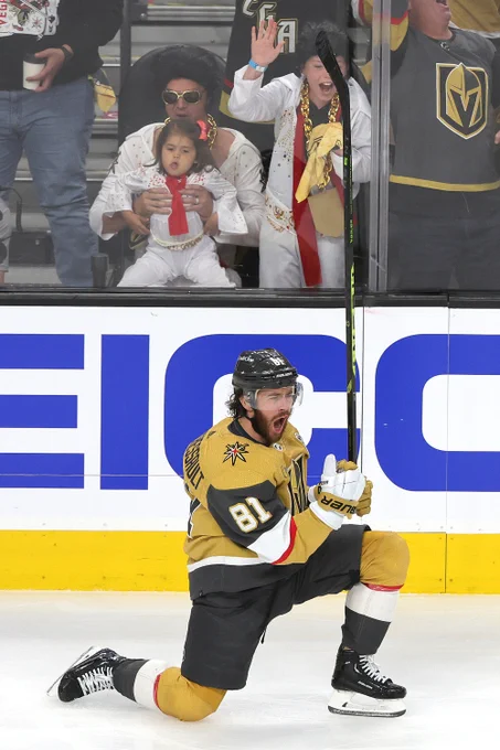 Jonathan Marchessault celebrates a goal with three fans dress as Elvis in the front row