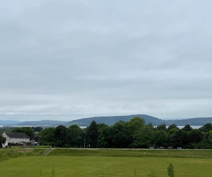 Photo showing the view over fields towards the Kessock Bridge.