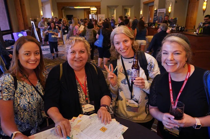 Speakers and attendees playing Peachpit’s bingo networking game during our welcome reception sponsored by Adobe