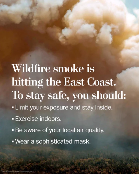 Pictured is an aircraft dropping a mix of water and fire retardant on a fire near Barrington Lake in Shelburne County, Nova Scotia. The text reads, “Wildfire smoke is hitting the East Coast. To stay safe, you should: limit your exposure and stay inside, exercise indoors, be aware of your local air quality, and wear a sophisticated mask.” (Nova Scotia government/AFP/Getty Images)