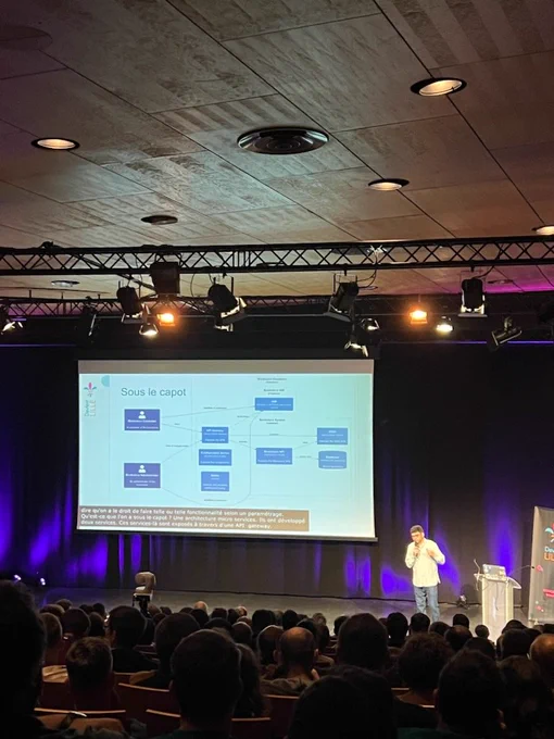 Photo de l'écran affiché pendant la conférence 
