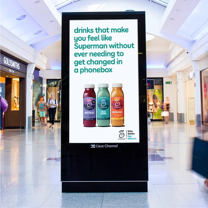 This is another advert that also MIGHT have been written by ChatGPT. But who knows? It's the same billboard with the same drinks on it, but the tagline is different. This tagline reads "drinks that make you feel like Superman without ever needing to get changed in a phonebox."